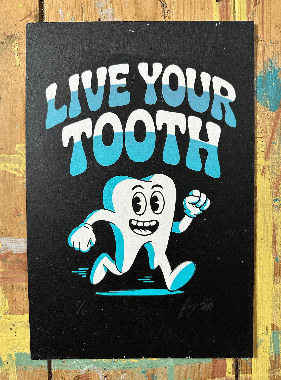 Live Your Truth edition 7/11 screen print on wood panel by Fox Fisher, cartoon tooth character with white and teal lettering on black background, signed and numbered limited edition artwork