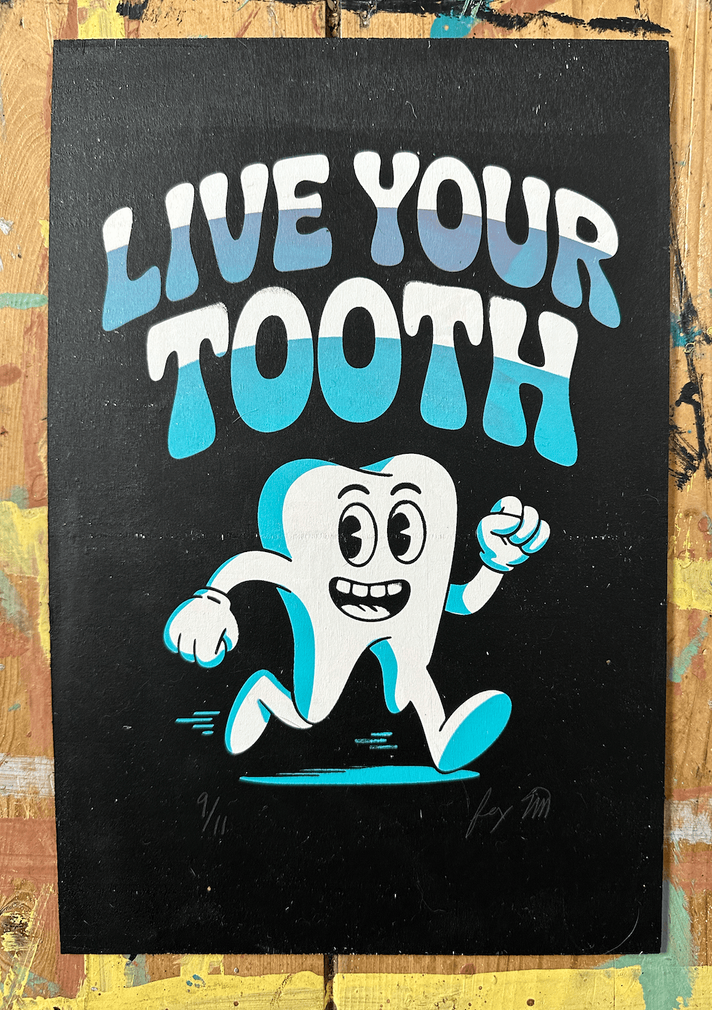 Live Your Truth edition 9/11 screen print on wood panel by Fox Fisher, cartoon tooth character with blue to cyan gradient lettering on black background, signed and numbered limited edition artwork