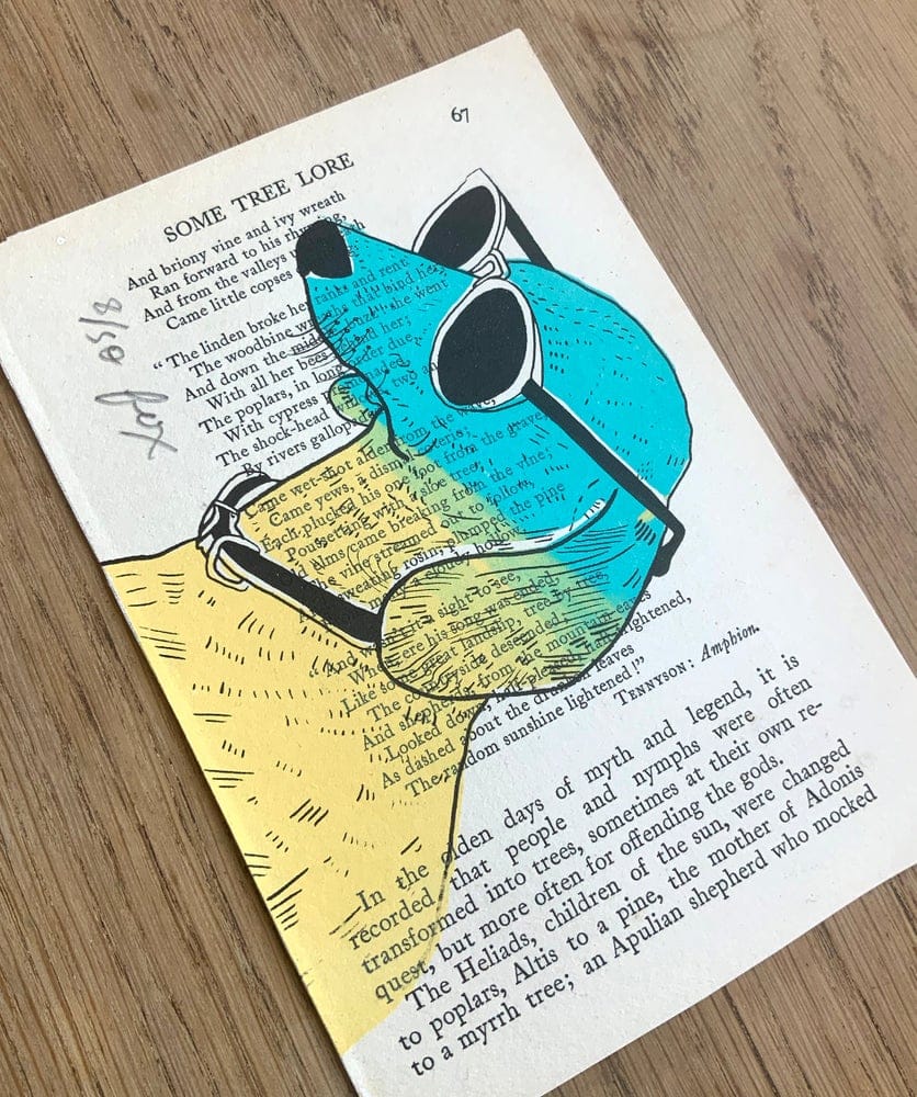Dog wearing sunglasses screen print by Fox Fisher on vintage book page, teal and yellow ink illustration, hand-pulled art from Fox's Snail Mail Art Club subscription